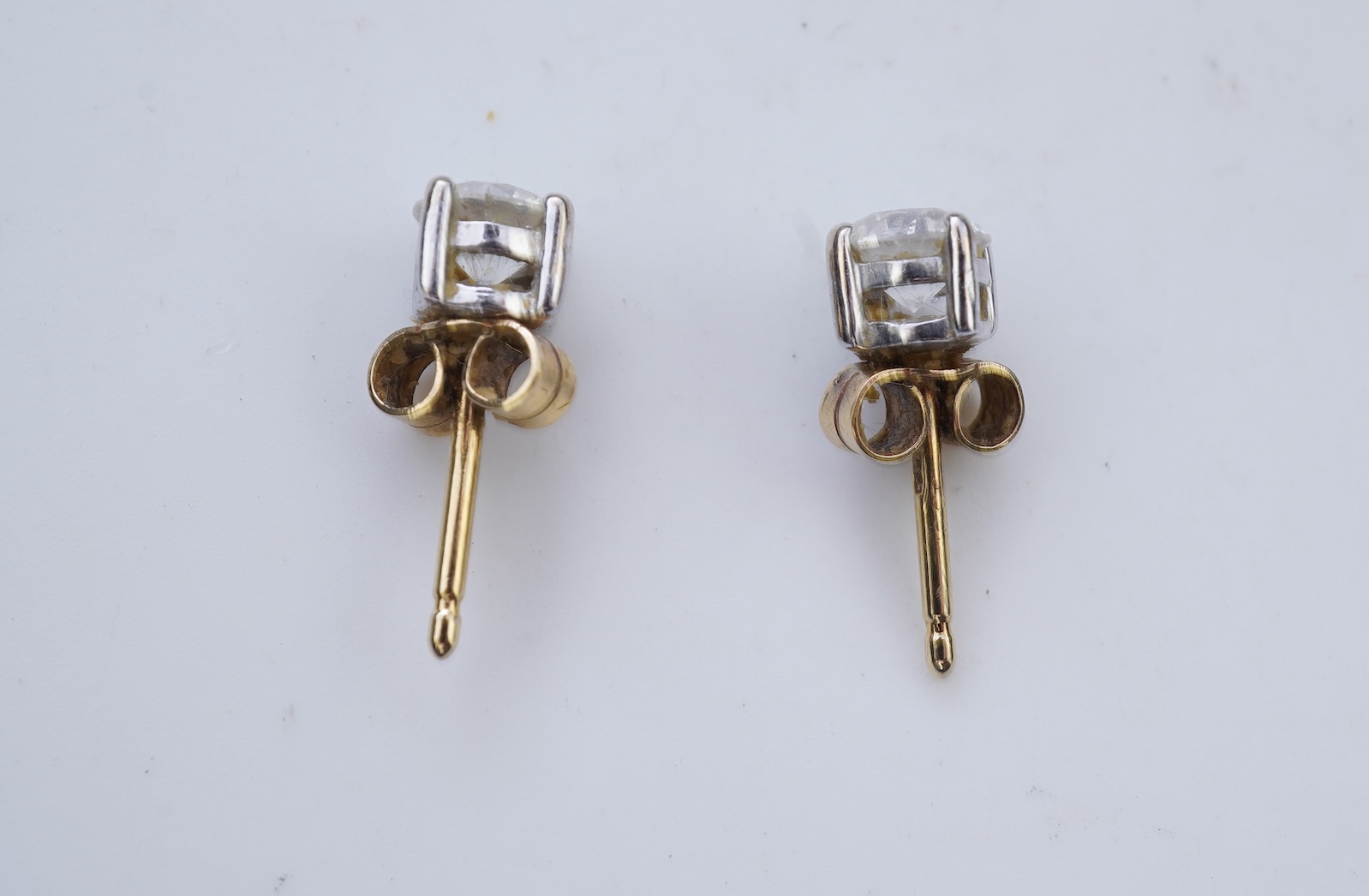 A pair of diamond stud earrings